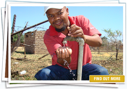 Man collecting clean water with his hands