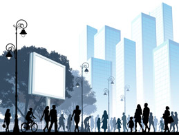 People walking and riding bicycles with skyscrapers in the background