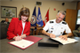 Cathy Mangum, director of center operations for NASA Langley Research Center, and Col. Paul Olsen, Norfolk District commander, sign a proclamation announcing a master support agreement between the two agencies for planning, design, engineering, project management, real estate and other engineering support services as required by the center. The agreement allows NASA Langley to reach out to the Corps of Engineers in a streamlined process; saving the center money and time.  (U.S. Army photo/Patrick Bloodgood)