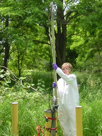 USGS scientist lowers borehole radar into a borehole near the Naval Industrial Reserve Ordnance Plant, Fridley, Minnesota