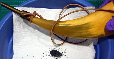 Powder horn with approximately 3 ounces of black powder discovered at Little Rock (LIT).  