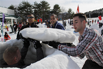 Combat Logistics Company 36 Marines place the roof on their igloo during the First World Igloo Building Championship competition, which took place at the Osorakan Snow Park, located in the town of Akiota, Feb. 3, 2013. Teams were limited to a maximum of six participants.