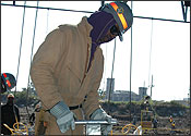 Man Working on Concrete Mats