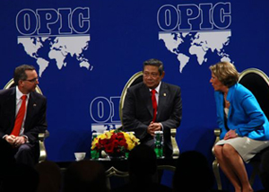 Three OPIC executives in public event