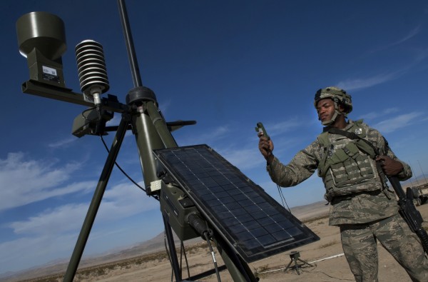 Senior Airman Michael Richardson takes weather readings with a TMQ-53 tactical weather sensor during training at Fort Irwin, Calif.