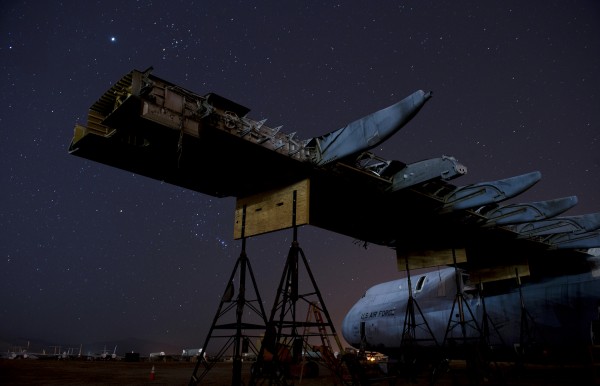 A C-5 Galaxy, its wings stripped to the frame, is undergoing a complete tear-down of all important parts before being demolished for scrap, a process that takes nearly a year to complete.