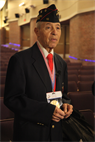 Retired Master Sgt. Johnnie Thompkins Jr., one of the first African Americans to enlist in the Marine Corps, prepares for an on-camera interview with a local television reporter after a ceremony celebrating the legacy of the Montford Point Marines, Friday.  On June 25, 1941, President Franklin D. Roosevelt issued Executive Order 8802; the elimination of racial discrimination from federal departments, agencies and the military. From 1942 to 1949, more than 20,000 black men trained on the hallowed grounds of Montford Point. Much like the African-American innovators who joined the other branches of service, the Montford Point Marines made their mark in history.