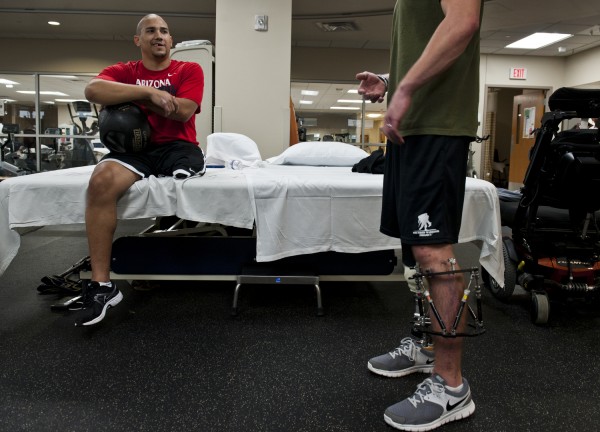 After finishing physical training, Williams talks to a fellow wounded warrior, who is also in the rehabilitation process at Walter Reed National Military Medical Center. 
