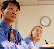 male and female students sitting in classroom