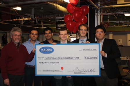 Picture of the MIT Red Balloon Challenge Team with an oversized check