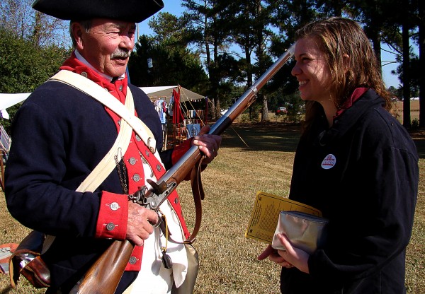 Buddy Bell, who portrays a rebel soldier of the American Revolution, explains his antique rifle to Lange during a re-enactment of the Battle of Camden in South Carolina. More than 200 re-enactors took part in the event, wearing uniforms and equipment vintage to the colonial era.