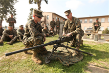 Pfc. Brandon Gigliotti, and Cpl. Patrick Fortune, military policemen with Bravo Company, 1st Law Enforcement Battalion, I Marine Expeditionary Force, inspect a .50-caliber machine gun during a weapons training course at Camp Pendleton, Calif., Feb. 7. Gigliotti, 19, is from Rancho Cucamonga, Calif., and Fortune, 24, is from Belvidere, S.D.


