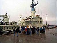 Hovey Clifford on the dock, describing equipment configuration aboard WHOI