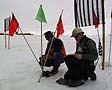 Surveyors take the season's last ice temperature readings at the ice runway.