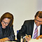 Minister Sander and Ambassador Fulton sign the agreement