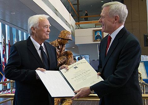 Secretary of the Navy (SECNAV) the Honorable Ray Mabus presents the Department of the Navy's highest award for civilians, the Navy Distinguished Public Service Medal, to U.S. Congressman C.W. 
