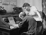 Black and white image of couple working on taxes