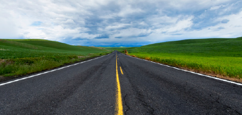 Aesthetic roadway stretching into the distance.