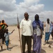 Two Kenyan pastoralists stand next to eachother