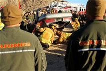 Combat Center firefighters rip apart a car from a simulated crash to show Combat Logistic Battalion 7 Marines the process of rescuing victims trapped in their vehicles. 