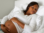 a pregnant woman sleeps