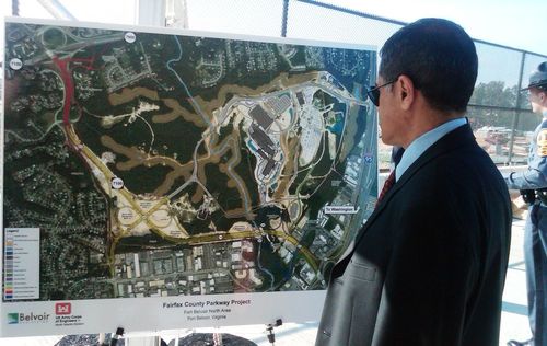 Administrator Mendez looks at an aerial map of the project