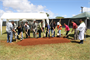 Kahu Sherman Thompson (far right) leads the groundbreaking ceremonies for a new 140 personnel barracks slated to be occupied by the 307th ITSB. Those lifting the ceremonial shovels included U.S. Army Garrison - Hawaii Executive Officer Col. Jay Hammer (fifth from left), Honolulu District’s Chief, Construction Branch, Louis Muzzarini (fourth from left) and Stan Sagum, project engineer, SUMO-NAN JV (sixth from left). 