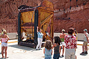 photo: People along tour route by concrete construction bucket