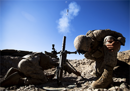 Lance Cpls. Justin Downing and Patrick Walker, mortarmen with Lima Company, 3rd Battalion, 3rd Marine Regiment, brace themselves while firing a 60mm mortar round during Exercise Clear, Hold, Build 3 on Marine Corps Air Ground Combat Center Twentynine Palms, Calif., Sept. 21, 2011. The two-day evolution — part of the Enhanced Mojave Viper training exercise — enabled “America’s Battalion” to improve its capabilities as the ground combat element of a Marine Air-Ground Task Force. The exercise is their final pre-deployment training event before deploying to Afghanistan’s Helmand province next month to support Operation Enduring Freedom. Downing, 18, is from Huntingtown, Md. Walker, 25, is from Clearwater, Fla.