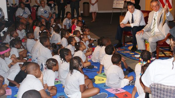 Wide shot of reading to group