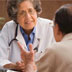 An image of a health professional speaking with a man and woman