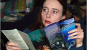 Woman studying NOAA OE Education Brochure