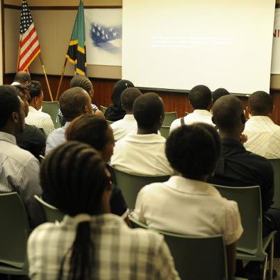 Photo: Deputy Chief of Mission Robert K. Scott discusses with guests the United States' commitment to partner with Tanzanians to combat human trafficking.