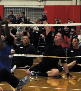Army volleyball team 1 defends the net in their game against the Air Force.