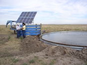 Producer, Bill Whiting, and NRCS Tribal Liaison, Mary Scott discussing the solar panel system