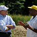 USAID Deputy Administrator speaks with partner while in an agricultural field
