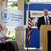 U.S. Ambassador to Haiti Kenneth Merten shakes hands with a program graduate