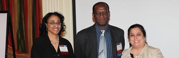 Planning Committee Co-Chairs Bessie Young and Sylvia Rosas with Lawrence Agodoa