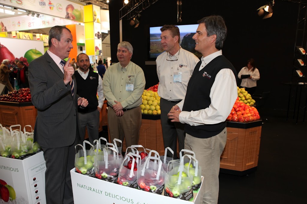 Ambassador Murphy engaged in conversation with U.S. exhibitors at the Fruit Logistica in Berlin 2012