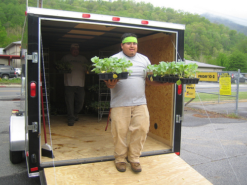 Volunteer George Welch unloads Garden Wagon plants.  