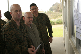 From left, U.S. Marine Corps Staff Sergeant David Ells, signal intelligence chief; Major Kenneth Laretto, staff judge advocate; and Gunnery Sergeant Mario Delgado, senior intelligence analyst, 3d Marine Expeditionary Brigade, participate in a Humanitarian Assistance & Disaster Response (HA/DR) practical exercise Jan. 17, 2013 aboard Camp Courtney, Okinawa, Japan.  Marines and sailors of III Marine Expeditionary Force learn about civil-military roles in international disaster response during a Joint Humanitarian Operations Course (JHOC) conducted by the Office of U.S. Foreign Disaster Assistance (OFDA), United States Agency for International Development (USAID).  (U.S. Marine Corps photo by CWO2 Jonathan C. Knauth/Released)
