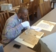 I AMM Fellow Anthony Thompson browses archival material. Photo courtesy of the Meek-Eaton Black Archives