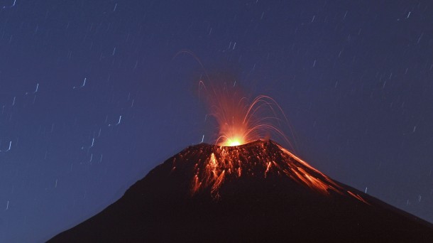 This photo, taken recently at a slow shutter speed shows lava flowing down central Ecuador's Tungurahua volcano.(AP Photo/Dolores Ochoa)