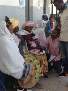 Members of the press interview women at a health center in Mikawa, Ethiopia. Photo credit: Nicole Schiegg