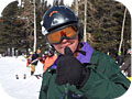 Veteran on the slopes giving thumbs up.