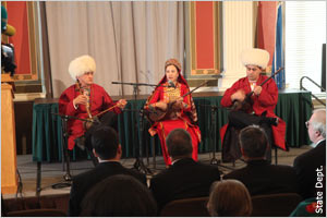 Three musicians from Turkmenistan perform November 28 at the Library of Congress. One plays a ghidjak (at left); the other two play the dutar, a two-stringed lute.