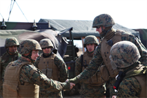 Col. Roger A. Garay, commanding officer of the 14th Marine Regiment, greets his artillery Marines during the Mission Rehearsal Exercise for African Lion 2013. The troops, assigned to Marine Forces Reserve, performed various live-fire battle drills before the unit deploys to AL-13 in Morocco this spring. This will be the first time the unit will demonstrate both the High-Mobility Artillery Rocket System and M777 Howitzer capabilities for their Moroccan partners. African Lion is an annual multinational exercise executed under the supervision of Marine Forces Africa Command. (U.S. Marine Corps photo by Sgt. Ray Lewis/Released)