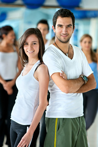 A group of people wearing athletic attire in a gym; Shutterstock.com