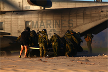 Charlie Company, 1st Reconnaissance Marines along with Japanese recon and intelligence soldiers carry a rubber boat into the back of a CH-53E Super Stallion during helocasting training near Marine Corps Base Camp Pendleton, Calif., Jan. 31. As part of the "Iron Fist" initiative between the Marine Corps and Japanese military, this training exchanged operating procedures and experience with the Marine Corps allies overseas.