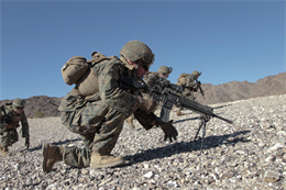 MARINE CORPS AIR GROUND COMBAT CENTER, TWENTYNINE PALMS, Calif.- U.S. Marines with Bravo Company, 1st Battalion, 4th Marine Regiment, 13th Marine Expeditionary Unit, maintain a low profile while moving to their target, during Exercise Iron Fist 2013, aboard Marine Corps Air Ground Combat Center, Twentynine Palms, Calif. Jan. 31, 2013. During Iron Fist 2013, 13th Marine Expeditionary Unit and JGSDF will spend three weeks participating in bilateral training to improve their interoperability, enhance military-to-military relations and sharpen skills essential to crisis response.  (U.S. Marine Corps photo by Lance Cpl. David Gonzalez/ Released)